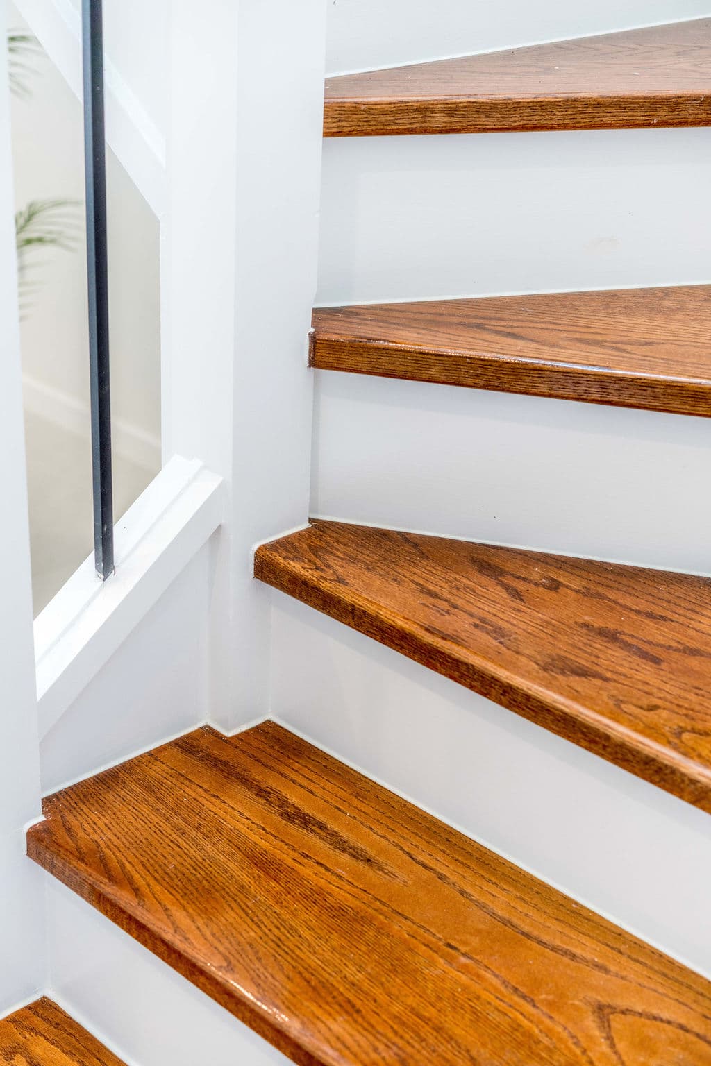 Wilton project — traditional staircase with timber treads and iron spindle balustrade, craftsmanship detail